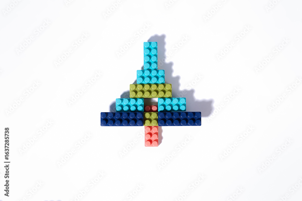 Fototapeta premium Christmas Tree Shape Made of Colorful Building Blocks