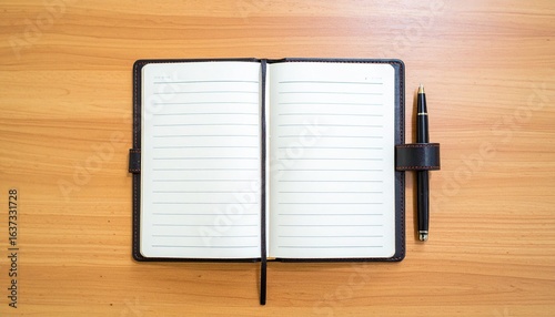 An open notebook with empty lined pages and a pen on a wooden desk background. Workspace for journaling, studying, or planning.