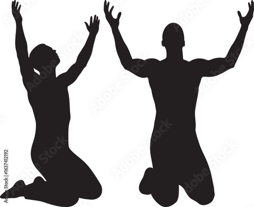 Two people kneeling with arms raised in worship silhouette