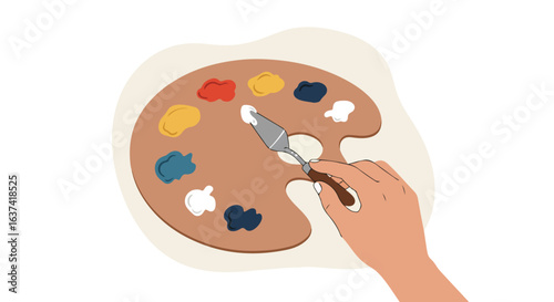 Art creation Hand using a palette knife and paint palette with colorful paints