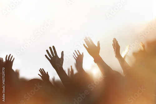 Christians passionately praising, praying, and worshipping, a background of a church gathering filled with the Holy Spirit, and a cheering crowd concept.
