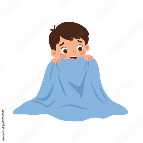 Scared young boy peeking from under a blue blanket.