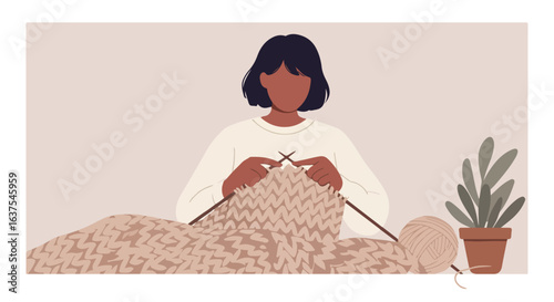 Woman knits with yarn in a cozy indoor scene, pot plant next to her on the surface
