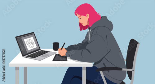 Digital artist working. Pink hair. Laptop, pen, tablet, coffee, desk, chair, hoodie