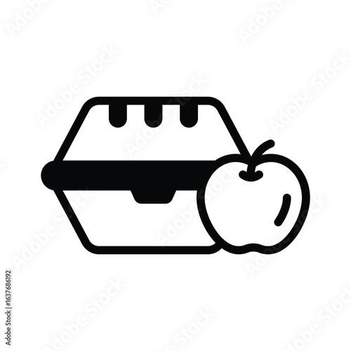 A glyph icon of lunch box and apple