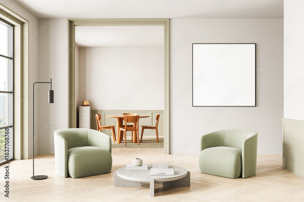 Fototapeta premium Modern minimalist living room interior with blank square poster mockup on wall above green armchairs and round coffee table in bright clean space. 3D Rendering