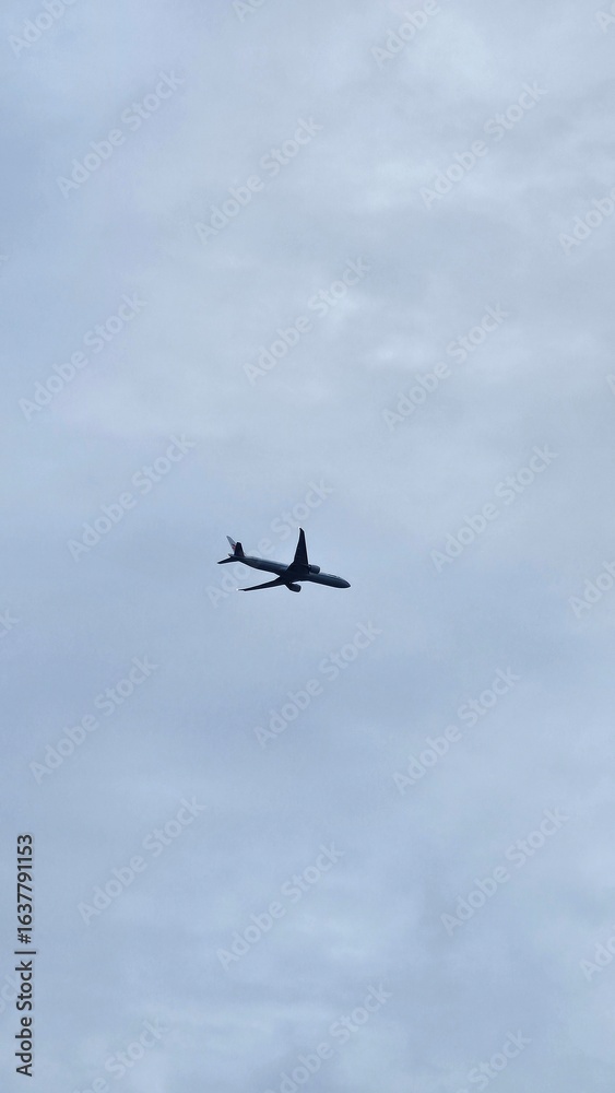 The airplane is flying over residential buildings. The airplane is flying over residential buildings.