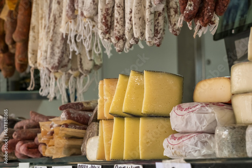 Food stall with dairy and meat products at Majorca farmers market Spain