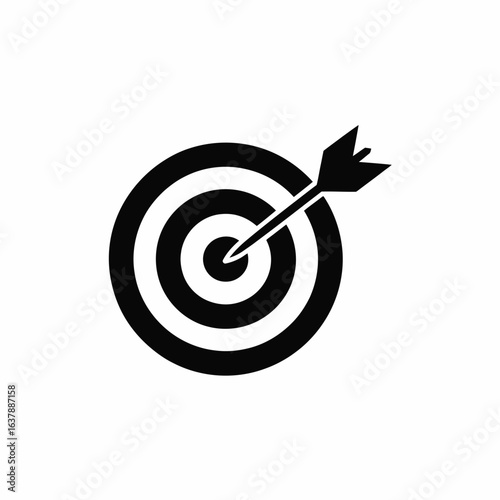 Black and white target with arrow in the bullseye