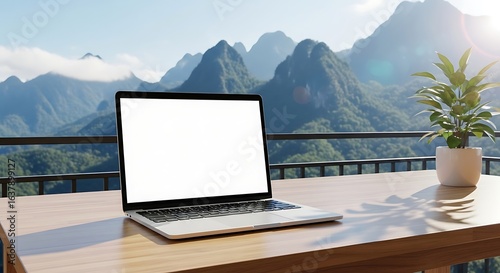 Inspiring workspace mockup with blank laptop screen and mountain views perfect for digital nomad lifestyle