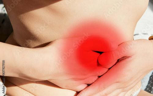 фотографія Women experiencing abdominal pain due to constipation and gastrointestinal probl