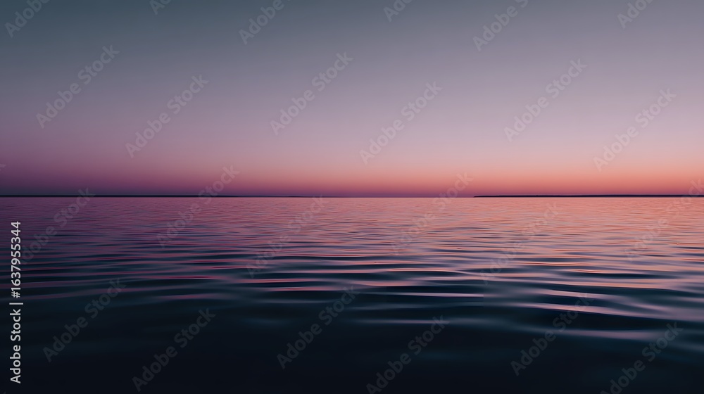 Fototapeta premium Calm water reflecting a vibrant sunset.