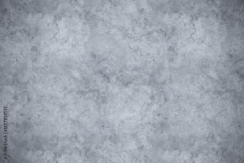 Smooth textured gray concrete wall with a subtle mottled pattern and a hint of grunge, creating a versatile background