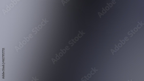 A blurry gradient background transitioning from light gray to dark gray with soft smooth transitions
