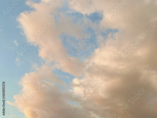 Canvas Print afternoon skies with soft light blue sky and broken white clouds