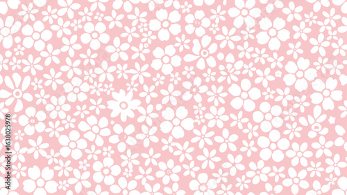 A delicate pattern of white floral designs scattered across a light pink background creating a soft texture