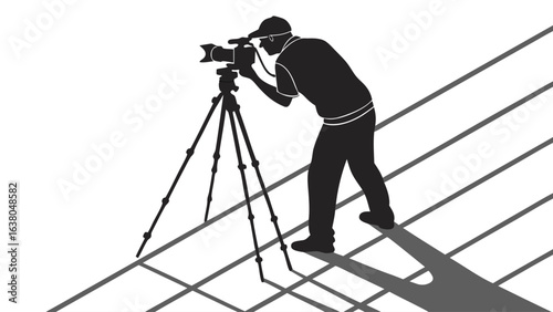 Silhouette of a Cameraman with Camera on Tripod.