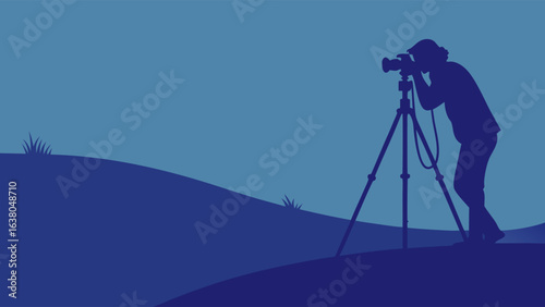 Silhouette of a Photographer with Tripod on a Hill.