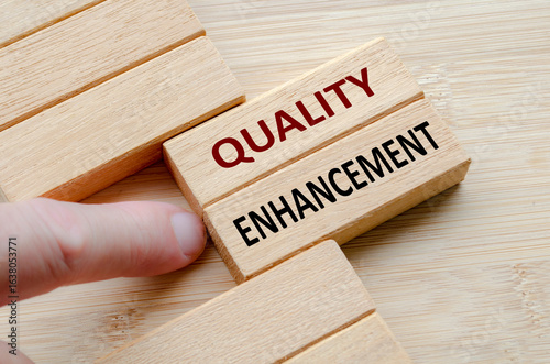 Canvas Print QUALITY ENHANCEMENT text on wooden blocks, Comprehensive measures for quality en