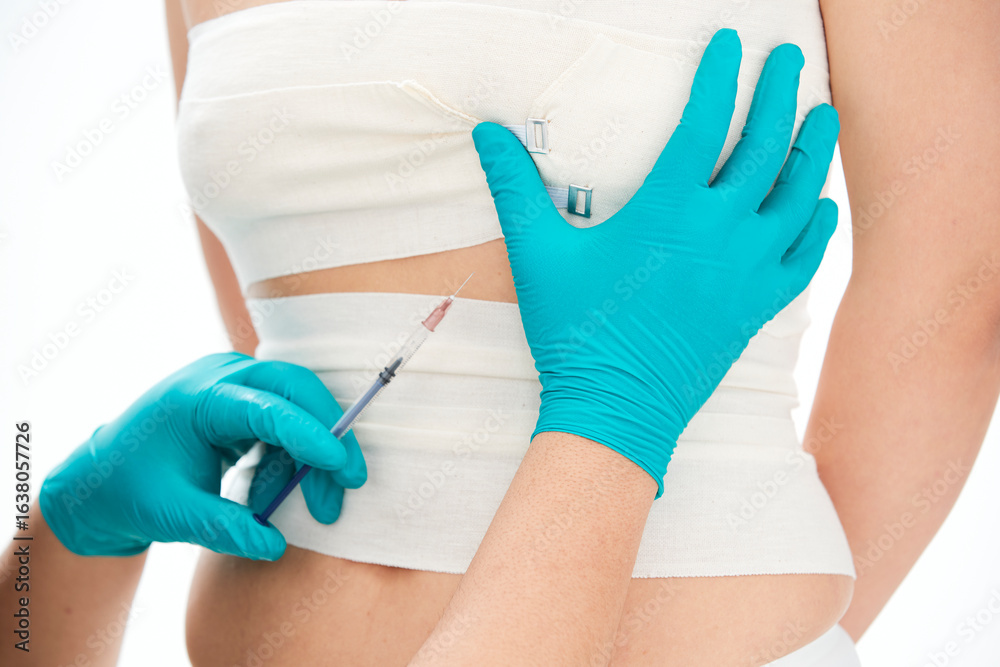 Fototapeta premium Medical aesthetic body contouring injections and examinations