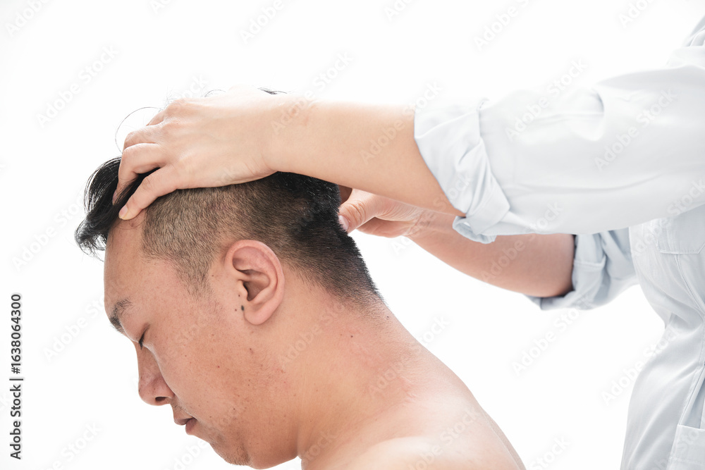 Fototapeta premium A professional massage therapist gives a body massage to a man.