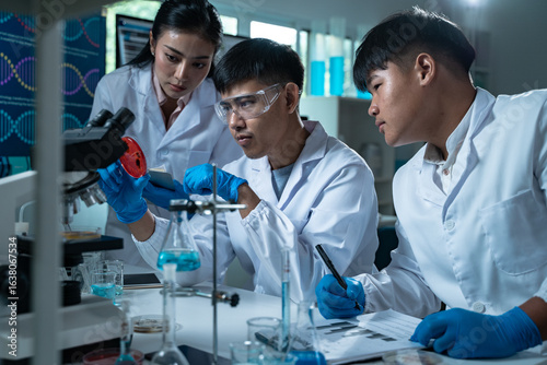 Multidisciplinary science students work in a modern lab analyzing microbial samples to support research in biology chemistry health and other scientific fields
