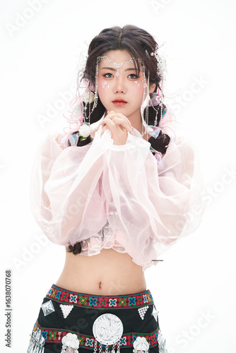 An Eastern girl dressed in the traditional costume of the Hani ethnic minority, which is popular among online influencers.