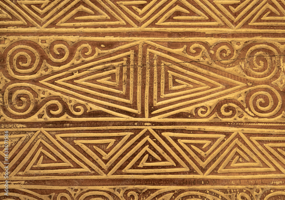 Complicated triangle patterns on an old wooden door create an interesting background in brown colors Complicated triangle patterns on an old wooden door create an interesting background in brown colors