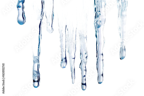 A close-up view of icicles melting, showcasing the intricate details of dripping water, set against a stark black background, ideal for illustrating winter themes or nature's beauty