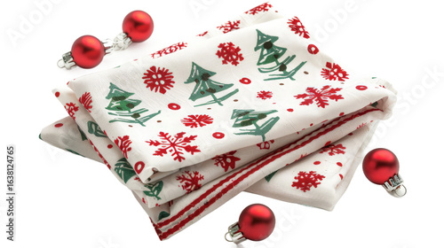 A festive arrangement featuring decorative holiday napkins adorned with Christmas trees and snowflakes, complemented by shiny red ornaments, ideal for seasonal dining and celebrations