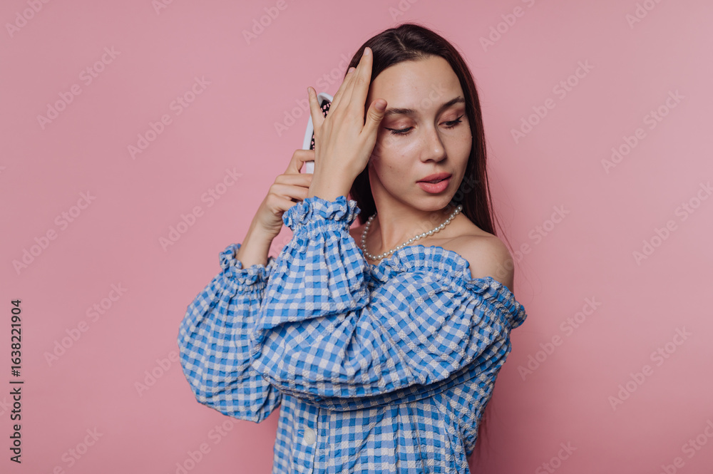 Fototapeta premium Woman in Blue Checkered Blouse with Phone