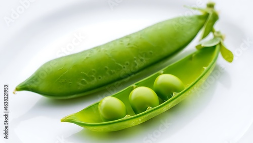 Wallpaper Mural Fresh green pea pod with three round peas inside on a white plate Torontodigital.ca