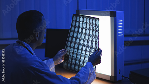 Photos Doctor and MRI. MRI of the patient's head. High-quality photo.