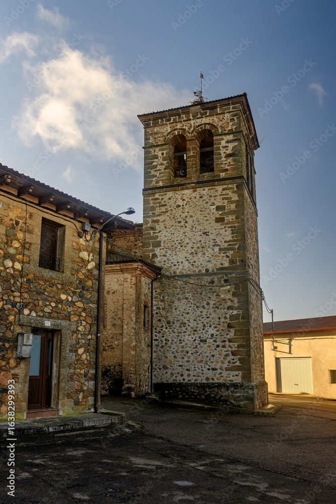 Obraz premium Bell tower of San Pedro Church in Pino del Rio village, Palencia