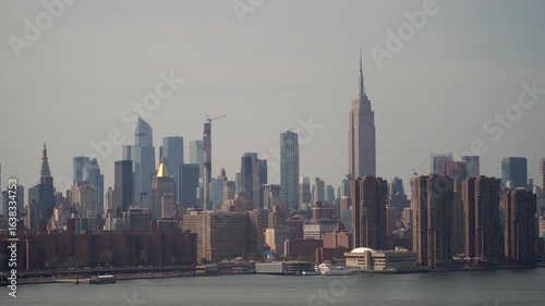New York Citys stunning skyline showcases remarkable skyscrapers by a serene and peaceful waterfront
