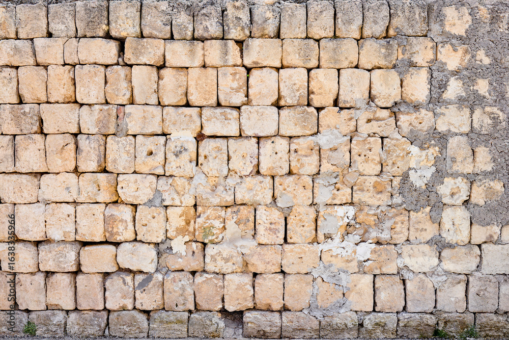 Fototapeta premium parete in mattoncini irregolari 