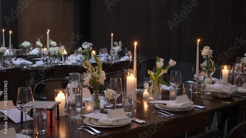 A beautifully arranged dining table featuring floral centerpieces and candlelight for a cozy atmosphere.