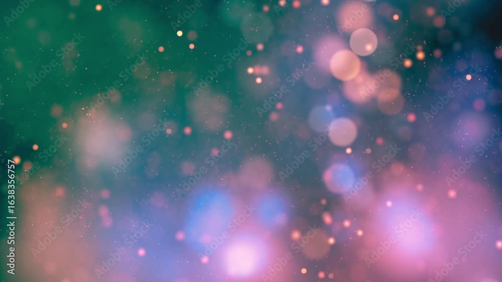 Bright colorful pink and blue bokeh lights create a festive and sparkling abstract holiday background