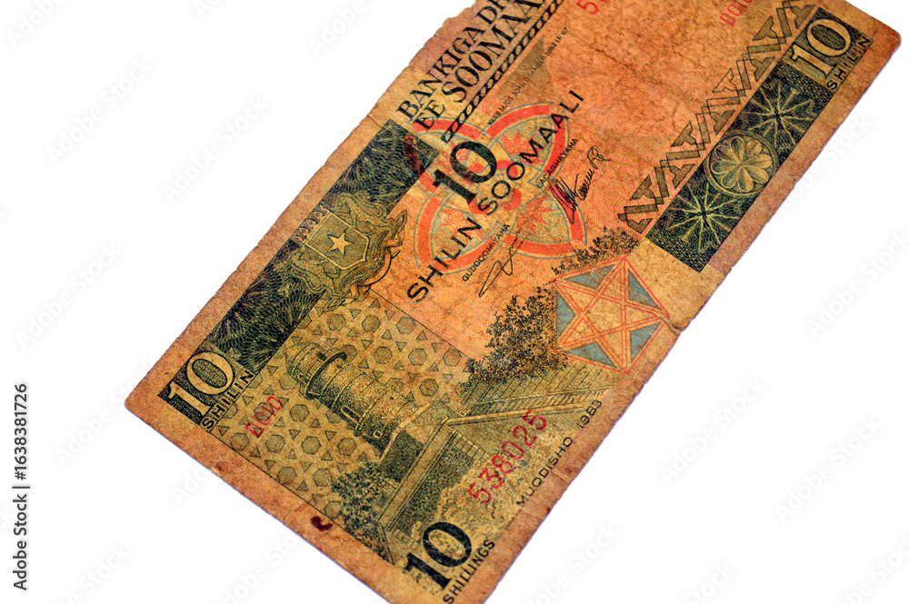 Fototapeta premium the obverse side of 10 SOS ten Somali Shilin Shillings cash money banknote, features Almnara Tower of Abdulaziz Mosque in Mogadishu, and National Coat of Arms, by Central Bank of Somalia