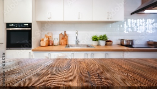 empty beautiful wood table top counter and blur bokeh modern kitchen interior background in clean and bright banner ready for product montage