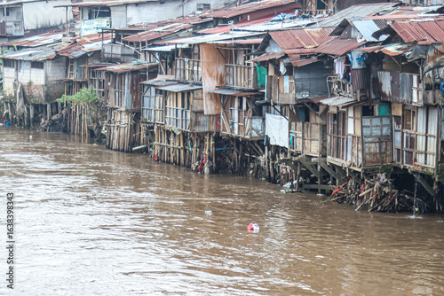 Photos Residents' activities in a slum area on the riverbank.