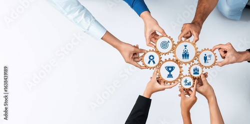 Fotografie Visual representation of collaboration and teamwork featuring diverse hands working together over gear icons symbolizes strategic planning and achievement goals in business