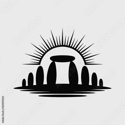 Silhouette of stonehenge with a radiant sunburst behind it