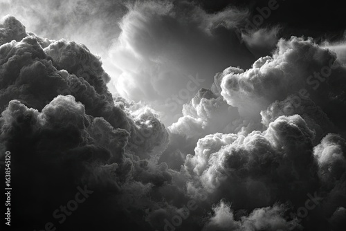 Dramatic black and white clouds, sunlit