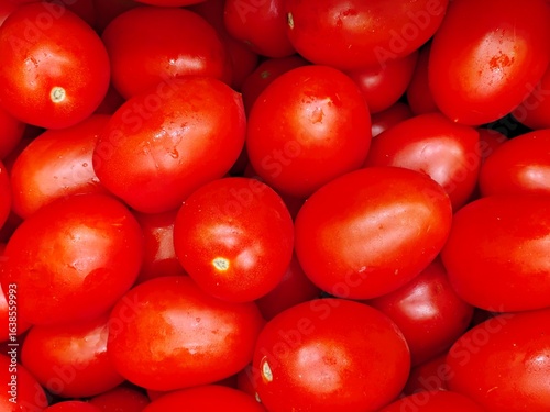 Set of red pear tomatoes. Background of healthy food. © TopMicrobialStock