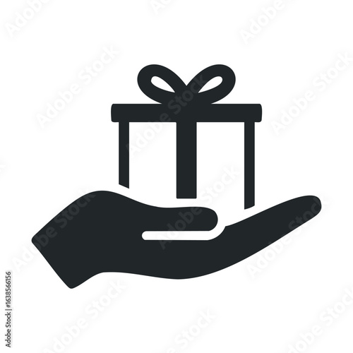 Hand holding a gift box icon with ribbon bow