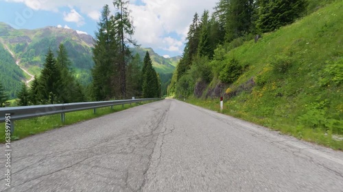 Driving through dolomites mountain roads in italy
