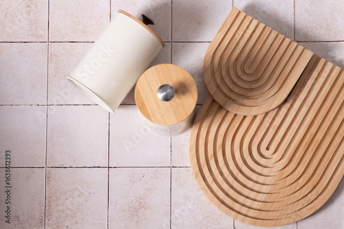 kitchen boards, storage jars. beige kitchen tile background