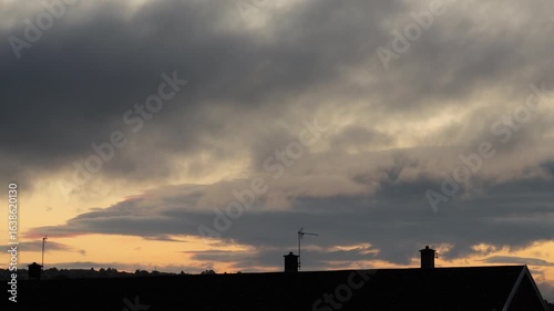 Timelapse of Sunrise Clouds Over City Rooftops