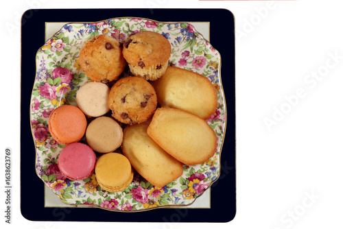 A selection of teatime cakes, including cupcakes ,madeleines and macarons.
